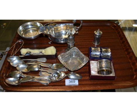 A group of silver including a sauce boat, a Victorian tortoise shell mounted ring box, two pepperettes, three napkin rings, a