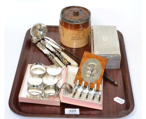 A silver cigarette box, silver mounted sprigged tobacco jar, silver mounted burr walnut ink blotter, silver toast rack, six s