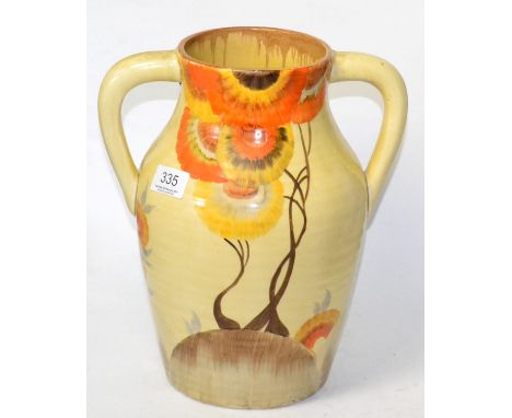 A Clarice Cliff twin handled lotus jug (cracked) 