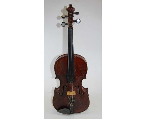 An early 20th century Czechoslovakian violin, having a two piece back, ebony finger board and mother of pearl inlaid pegs, be