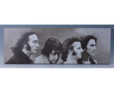 A contemporary print on canvas showing The Beatles in profile, 30 x 90cm, together with two other canvas prints of Jimi Hendr