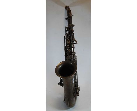 An early 20th century silver plated C.G. Conn saxophone, marked C.G. Conn Ltd Elkhart Ind. USA, further marked Sole English A