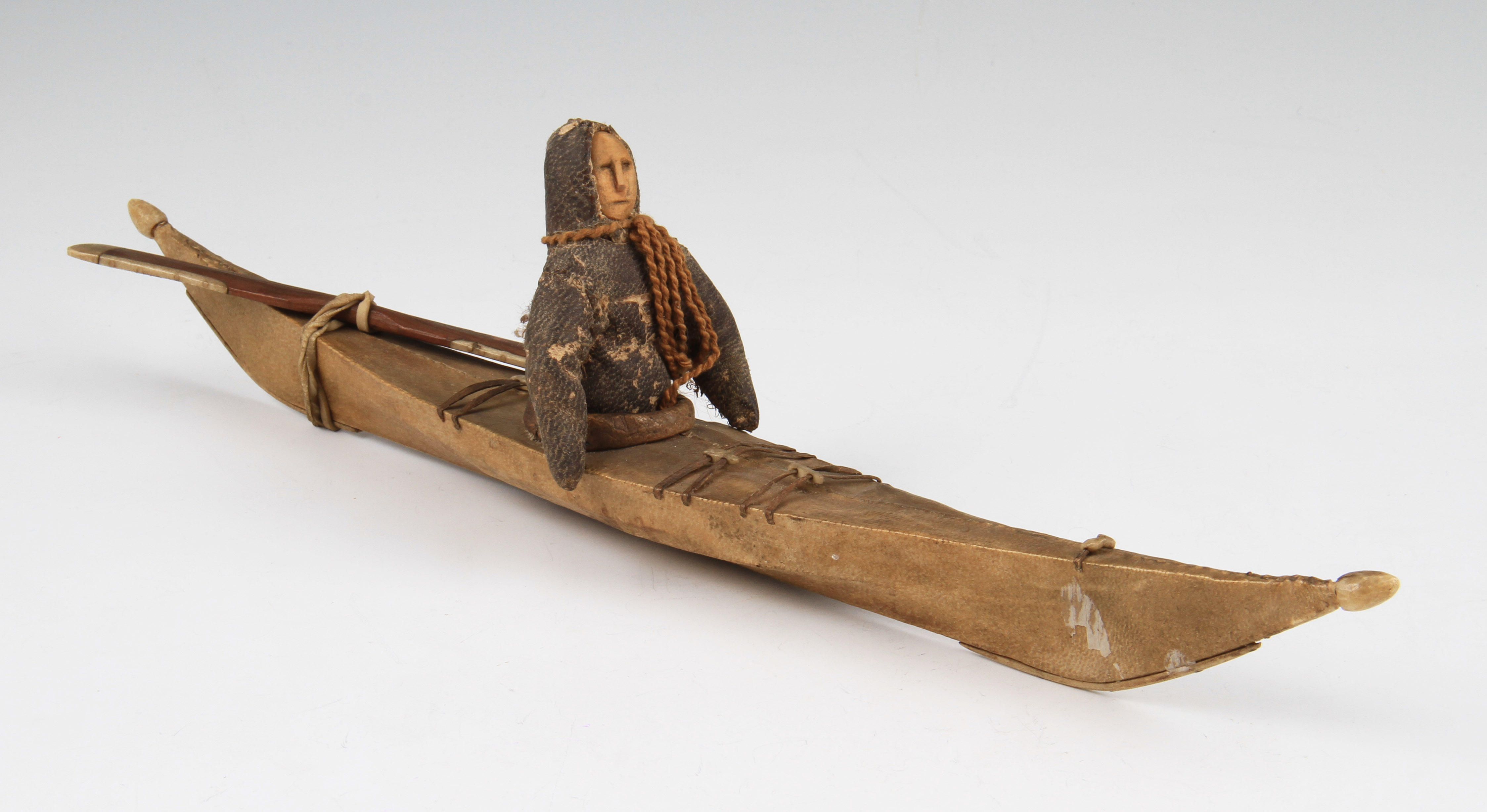 An early 20th Century Inuit kayak toy model, the kayak of wood and ...