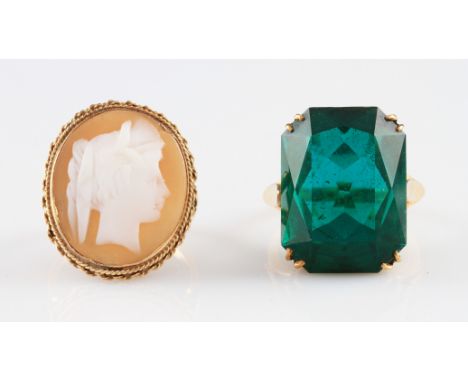 A 9ct yellow gold green paste dress ring, set with a central emerald cut green paste, with open gallery and applied navette m