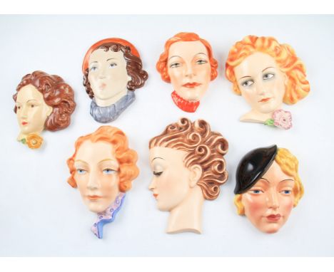 A group of seven Art Deco ceramic female wall plaques to include; Beswick model number 8205, Peggy Davis, three by William Go