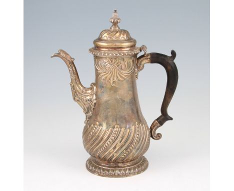 A George II silver coffee pot, of baluster form with repousse curved design to lower body and repousse wave design to top of 