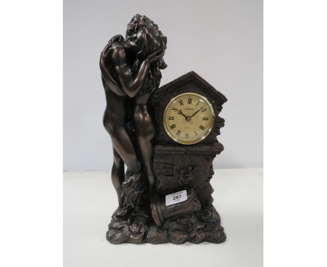 A BRONZED STYLE RESIN&nbsp;FIGURAL MANTEL CLOCK
