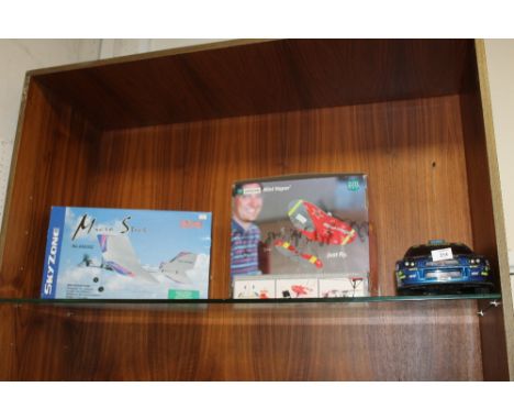 A MICROSTICK NO 4383SZ MODEL RADIO CONTROLLED PLANE TOGETHER WITH A BOXED MINI VAPOR AND RADIO CONTROLLED SUBARU CAR - ALL UN
