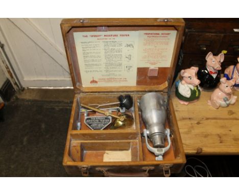 AN OAK CASED 'THE SPEEDY MOISTURE TESTER' BY THOMAS ASHWORTH &amp; CO