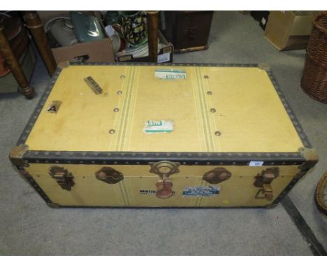 A LARGE VINTAGE STUDDED PACKING TRUNK 