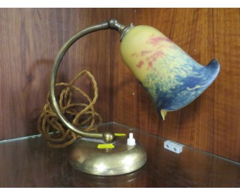 A VINTAGE BRASS DESK LAMP WITH COLOURED GLASS SHADE
