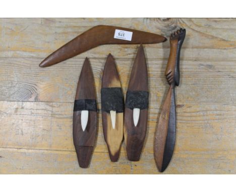 THREE AUSTRALIAN ABORIGINAL WOODEN MINIATURE SPEAR THROWERS (WOOMERA'S) WITH BONE BARBS, A SMALL WOODEN KNIFE AND A MINIATURE