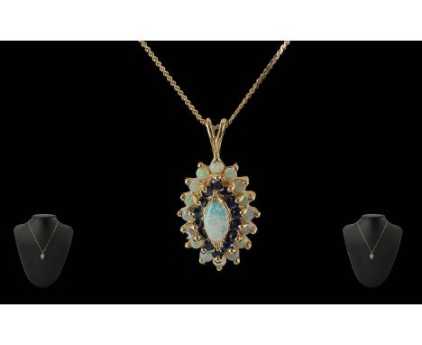 Ladies 9ct Gold Opal and Garnet Set Pendant and Attached 9ct Gold Chain, Both Marked for 9ct. Length 18 Inches. Weight 4,4 gr