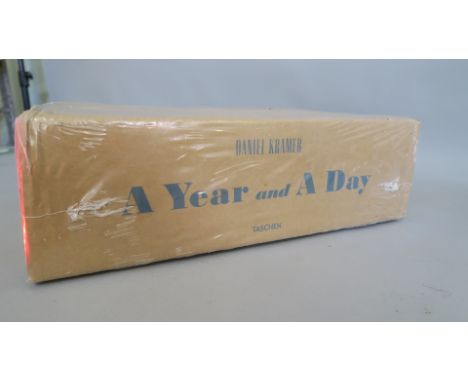 Bob Dylan sealed Taschen "A Year and a Day" by Daniel Kramer. This is in the original cardboard outer and a colllectable book