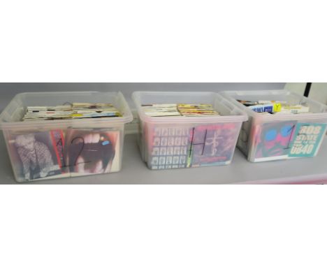 Collection of 3 boxes full of mainly brand new 7 inch singles from a closed record shop mostly with original sleeves contains