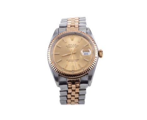 GENTLEMAN'S ROLEX DATEJUST STAINLESS STEEL AUTOMATIC WRIST WATCH,serial number 1267832, the round champagne dial with applied
