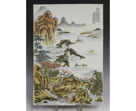 A Chinese rectangular porcelain plaque, late Qing dynasty, painted with figures and pavilions in a coastal landscape with pin