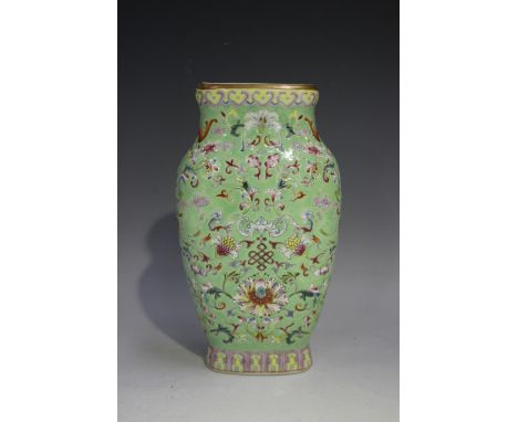 A Chinese famille rose enamelled green ground porcelain vase, mark of Qianlong but modern, of flattened form, decorated with 