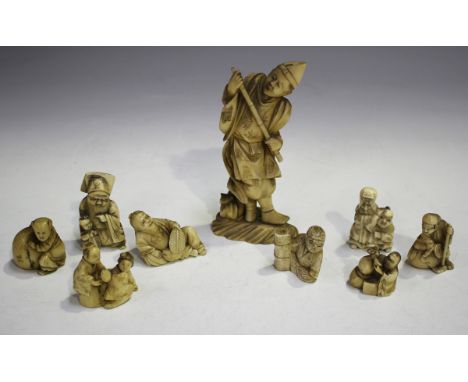 A group of eight Japanese carved ivory and bone okimono netsuke, Meiji period, each of figural form, unsigned, heights rangin