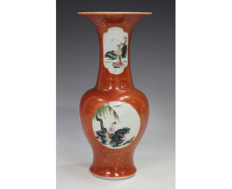 A Chinese famille rose enamelled and iron red ground porcelain vase, mark of Qianlong but probably late Qing dynasty, the bal