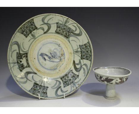 A Chinese provincial underglaze red decorated stem cup, painted with a phoenix amidst peony, height 8.6cm, together with a Ch