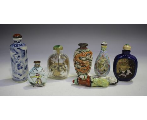 A group of seven Chinese snuff bottles, late Qing dynasty and later, including a relief moulded porcelain bottle, decorated w