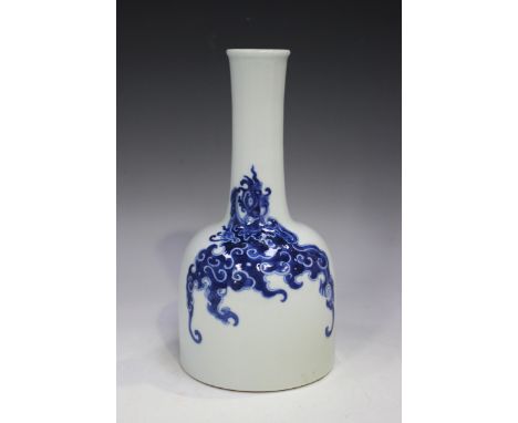 A Chinese blue and white porcelain bottle vase, mark of Kangxi but later, of mallet form, painted with opposing dragons, unde