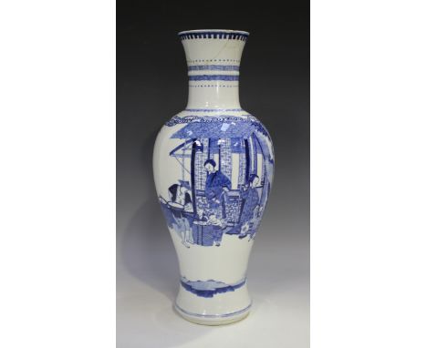 A Chinese blue and white porcelain vase, Kangxi style but later Qing dynasty, of baluster form, painted with a figural scene 