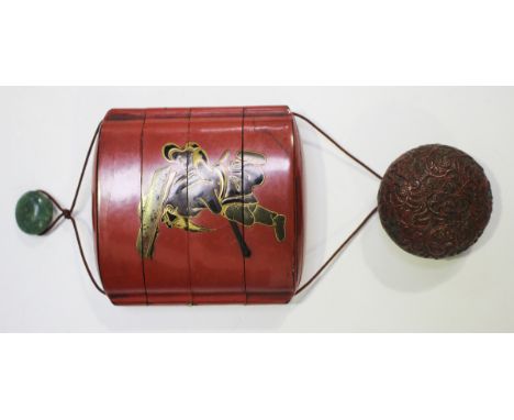 A Japanese red lacquer three-case inro, Meiji period, of flattened oval form, decorated in brown, black and gilt lacquer with
