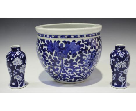 A pair of Chinese blue and white porcelain vases, mark of Kangxi but late Qing dynasty, each baluster body painted with prunu