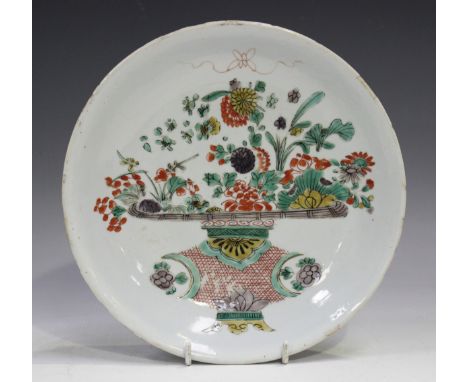 A Chinese famille verte porcelain saucer dish, Kangxi period, painted with a flower basket, underglaze blue Mandarin mark of 