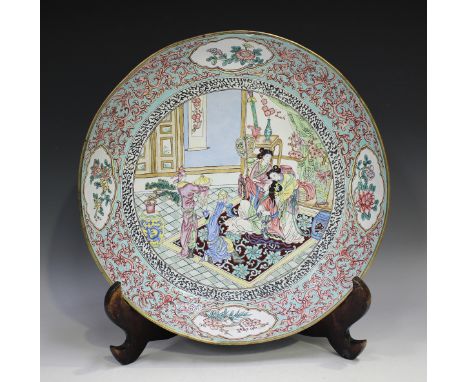 A Chinese famille rose enamel circular dish, mark of Qianlong but 20th century, the centre painted with a lady and attendants