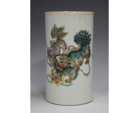 A Chinese famille rose porcelain brushpot, late Qing dynasty, of slightly waisted cylindrical form, painted with two Buddhist