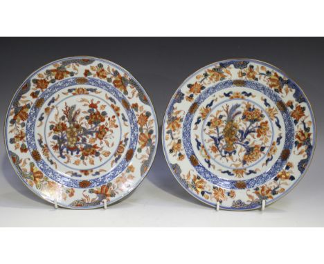 A near pair of Chinese Imari export porcelain plates, Kangxi period, each painted and gilt with vase and flowers, diameters 2