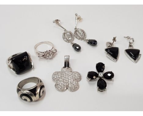 3 SILVER RINGS (ONYX, ENAMEL AND WHITE STONE) 2 SILVER PENDANTS (WHITE AND BLACK STONE) 2 PAIRS OF SILVER EARRINGS ONE IS ONY
