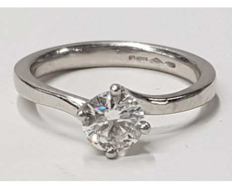 LADIES PLATINUM DIAMOND SOLITAIRE RING COMPRISING OF A SINGLE ROUND BRILLIANT CUT DIAMOND, SET IN A TWIST SETTING, FOUR CLAWS