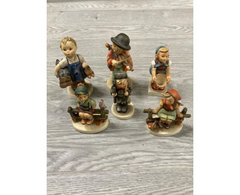 SIX GERMAN HUMMEL FIGURES OF CHILDREN AND A WOODEN STORAGE BOX