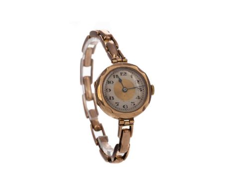 LADY'S NINE CARAT GOLD MANUAL WIND WRIST WATCH,the cream dial with central gold coloured section, Arabic hour markers, railro