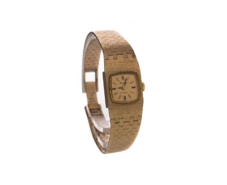 LADY'S ACCURIST NINE CARAT GOLD MANUAL WIND WRIST WATCH,the gold coloured cushion shaped dial with applied baton hour markers