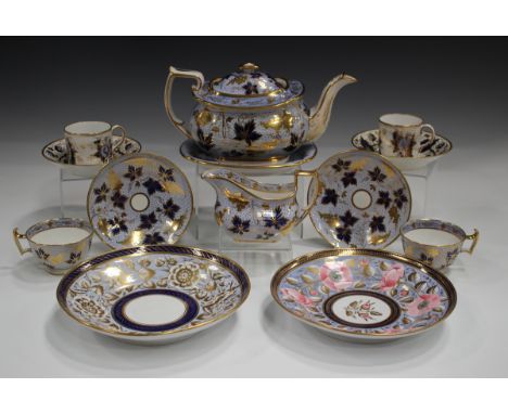 A Ridgway part tea service, circa 1810, pattern No. 2/24, painted with gilt fruiting vine on dark blue leaves against a pale 