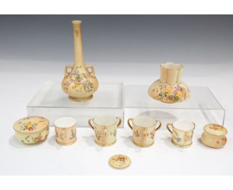 A small group of Royal Worcester blush ivory wares, decorated with flowers, comprising a two-handled vase with extended neck,