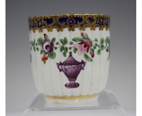 A Worcester fluted coffee cup, circa 1775, painted in the atelier of James Giles with an urn beneath a floral band and gilt o