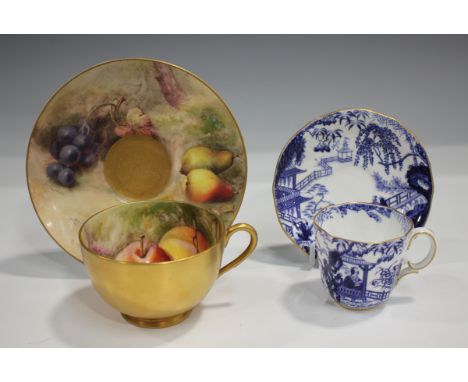 A Royal Worcester fruit painted cup and saucer, dated 1917, painted by Ricketts, signed, the cup exterior gilded, puce printe
