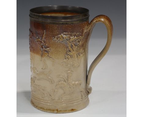 A Mortlake stoneware Punch Party tankard, circa 1800, the cylindrical body with plated rim, two-tone glazed, the main plaque 