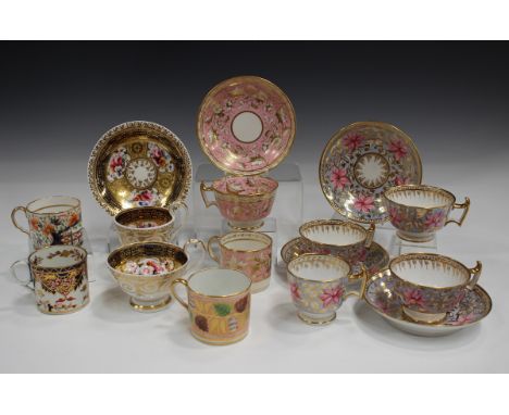 A mixed group of mostly Ridgway trios, teacups and saucers and coffee cans, 19th century, including a gilt overlaid pink grou
