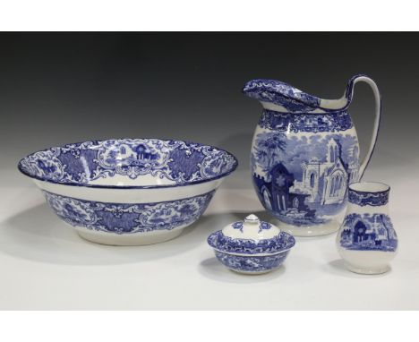 A George Jones Abbey pattern blue printed part wash set, comprising jug and basin, soap dish, cover and liner and toothbrush 