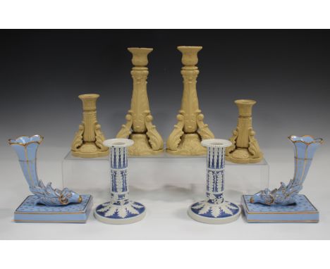 A pair of Ridgway buff stoneware candlesticks, circa 1835, of foliate moulded form with acanthus leaf struts to the circular 