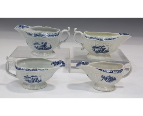 A Worcester blue painted Fisherman and Billboard Island press moulded sauceboat, circa 1760, with strap moulded sides and mou