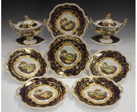 A Ridgway part dessert service, circa 1825, pattern No. 1175, painted with topographical panels against a gilt overlaid cobal