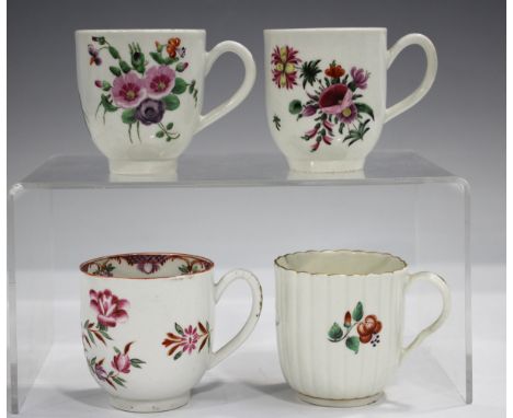 Two Worcester coffee cups, circa 1765, of typical U-shape with grooved loop handles, painted with differing bouquets of Meiss